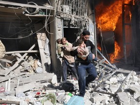 A file photo taken in February 2014 shows the devastation following a barrel bomb attack in the northern Syrian city of Aleppo. A source with Doctors Without Borders said “if war wounds are not treated correctly, they can often lead to further disability or a lack of functionality, particularly without the relevant physiotherapy post-operation.” (BARAA AL-HALABI/Getty Images)