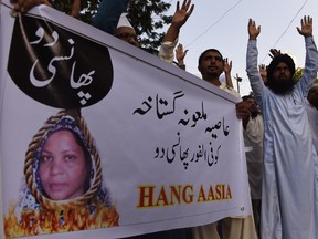 Pakistani protesters shout slogans against Asia Bibi, a Christian woman facing death sentence for blasphemy, at a protest in Karachi on October 13, 2016. Pakistan's Supreme Court delayed an appeal into the country's most notorious blasphemy case on October 13, against a Christian mother on death row since 2010, after one of the judges stepped down. (ASIF HASSAN/AFP/Getty Images)