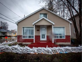 A home on Saint-Louis Street in Gatineau is surrounded by sandbags as flooding continues. CHRIS DONOVAN / POSTMEDIA NEWS