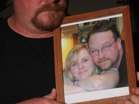 Mark Leblanc holds a picture of him and his wife, Deanna. (TRACY MCLAUGHLIN PHOTO)