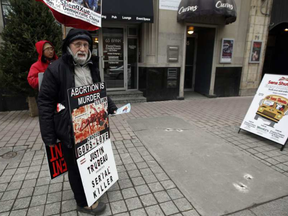 A man stands outside The Morgentaler Clinic where he said he's protested abortions for the past four and a half years Monday December 07, 2015. DARREN BROWN / OTTAWA CITIZEN