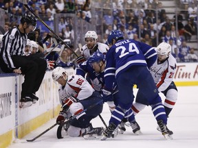 Morgan Rielly gets hit from behind by Tom Wilson as the Maple Leafs host the Washington Capitals in Game 4 at the Air Canada Centre in Toronto on April 19, 2017. (Michael Peake/Toronto Sun/Postmedia Network)
