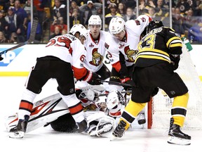 Craig Anderson, Erik Karlsson, Jean-Gabriel Pageau and Cody Ceci of the Ottawa Senators defend a shot from Brad Marchand of the Boston Bruins during Game 4 at TD Garden on April 19, 2017. (Maddie Meyer/Getty Images)