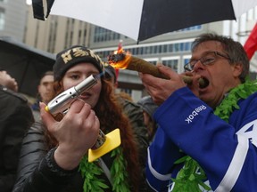 "Prince of Pot" Marc Emery ignites a huge joint at Thursday's 4/20 celebrations in downtown Toronto. (JACK BOLAND/Toronto Sun)