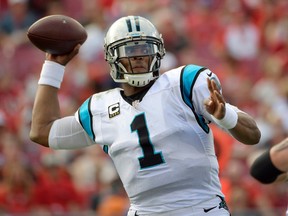 In this Jan. 1, 2017, file photo, Carolina Panthers quarterback Cam Newton throws an interception to Tampa Bay Buccaneers cornerback Brent Grimes during the third quarter of an NFL football game in Tampa, Fla. (AP Photo/Phelan Ebenhack, File)