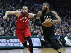 Milwaukee Bucks' Greg Monroe drives past Toronto Raptors' Jonas Valanciunas during Game 3 on April 20, 2017. (AP Photo/Morry Gash)