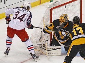 Columbus Blue Jackets' Josh Anderson (34) can't get a shot to go in over Pittsburgh Penguins goalie Marc-Andre Fleury (29) during the first period in Game 5 of an NHL first-round hockey playoff series in Pittsburgh, Thursday, April 20, 2017. (AP Photo/Gene J. Puskar)