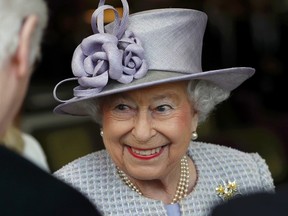 This is a Tuesday, April 11, 2017 file photo of Britain's Queen Elizabeth as she meets residents during a visit to Priory View, an independent living scheme for older residents, in Dunstable, England, Tuesday, April 11, 2017. Britain's Queen Elizabeth celebrates her 91st birthday on Friday, April 21, 2017. (Peter Nicholls/Pool Photo, File via AP)