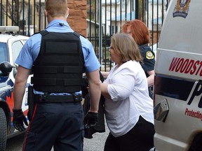 Elizabeth Wettlaufer is led into court in Woodstock Friday morning. MORRIS LAMONT/POSTMEDIA NETWORK