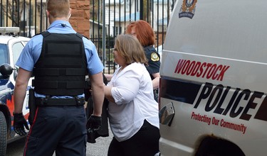 Former Woodstock nurse Elizabeth Wettlaufer is led into court in Woodstock Friday morning (MORRIS LAMONT/POSTMEDIA NETWORK)