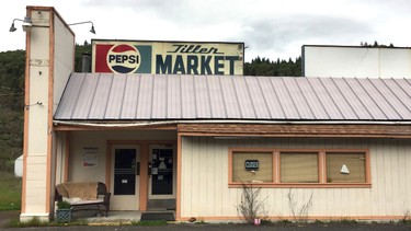 In this April 5, 2017 photo, the Tiller Market stands abandoned in downtown Tiller, Ore. Tiller, a dot on a map in remote southwestern Oregon, is for sale for $3.5 million, including the market, and the elementary school is for sale separately for $350,000. A potential buyer has come forward but is remaining anonymous -- and back-up offers are still being accepted.  (AP Photo/Gillian Flaccus)