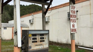 In this April 5, 2017 image taken from video, a gas pump stands abandoned, the price frozen in time, in downtown Tiller, Ore. Tiller, a dot on a map in remote southwestern Oregon, is for sale for $3.5 million, including the gas station, and the elementary school is for sale separately for $350,000. (AP Photo/Gillian Flaccus)