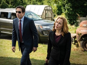 This photo provided by FOX shows, David Duchovny, left, as Fox Mulder and Gillian Anderson as Dana Scully in an episode of "The X-Files." Fox said Thursday it has ordered a second chapter of what it’s calling an “X-Files” “event series.” The 10-episode series will air during the upcoming 2017-18 TV season. (Ed Araquel/FOX via AP)