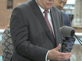 Ontario's Finace Minister Charles Sousa along announces the Liberals Fair Housing Plan in Liberty Village on Thursday, April 20, 2017, in Toronto. (Veronica Henri/Toronto Sun)