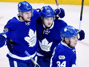 Toronto Maple Leafs centre Zach Hyman (11) celebrates his goal with teammates William Nylander (29) and Auston Matthews (34) during first period NHL hockey round one playoff action against the Washington Capitals, in Toronto on Wednesday, April 19, 2017. THE CANADIAN PRESS/Nathan Denette