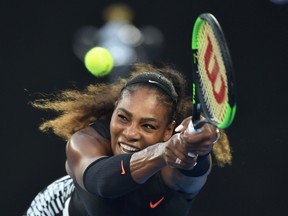 This file photo taken on Jan. 28, 2017 shows Serena Williams hitting a return against Venus Williams during the women's singles final on Day 13 of the Australian Open in Melbourne. (AFP PHOTO)