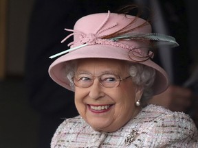 Britain's Queen Elizabeth II smiles on her 91st birthday as she attends an event at Newbury Racecourse in Newbury, England, Friday April 21, 2017. (Andrew Matthews/PA via AP)
