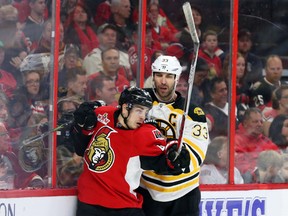 Senators’ Jean-Gabriel Pageau hits Bruins' Zdeno Chara at Canadian Tire Centre last night.  (Jean Levac/Postmedia Network)