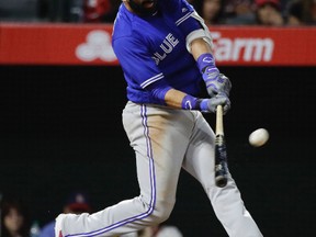 Toronto Blue Jays' Jose Bautista hits a three-run home run during the 13th inning of a baseball game against the Los Angeles Angels, Saturday, April 22, 2017, in Anaheim, Calif. (AP Photo/Jae C. Hong)