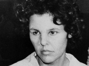 In this Oct. 21, 1981 file photo, Judith Clark is taken into police custody in Nanuet, N.Y.  (AP Photo/David Handschuh, File)