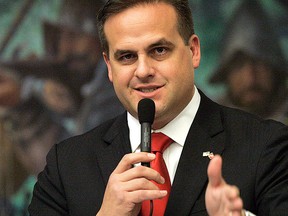 This March 9, 2012, file photo shows Republican state senator Frank Artiles, R-Miami, asking a questions about a pip insurance bill during house session in Tallahassee, Fla.  (AP Photo/Steve Cannon, File)