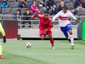 Ottawa Fury FC’s Eddie Edward tries to get the ball past Toronto FC II’s Jelani Peters on Saturday. (ASHLEY FRASER/Postmedia Network)