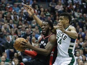 Raptors' DeMarre Carroll drives past Bucks' Giannis Antetokounmpo during the first half of Game 4 of their first-round NBA playoff series in Milwaukee on Saturday, April 22, 2017. (Morry Gash/AP Photo)