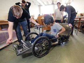 Mykel Gallajones, an engineering student, sits in the battery-powered vehicle at the University of Manitoba, in Winnipeg. Saturday, April 22, 2017. A local team of students from the University of Manitoba are putting the finishing touches on their battery-powered vehicle for the Shell Eco-marathon Americas competition taking place in Detroit next week. Chris Procaylo/Winnipeg Sun/Postmedia Network