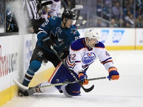 Marcus Sorensen of the San Jose Sharks checks Anton Slepyshev of the Edmonton Oilers during Game 6 of their Western Conference opening round series at SAP Center on Saturday, April 22, 2017, in San Jose, Calif. (Ezra Shaw/Getty Images)