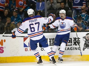 Edmonton Oilers left wing Anton Slepyshev (42) celebrates after scoring a goal with teammate Benoit Pouliot (67) during the second period against the San Jose Sharks in Game 6 of a first-round NHL hockey playoff series Saturday, April 22, 2017, in San Jose, Calif. (Tony Avelar/AP Photo)