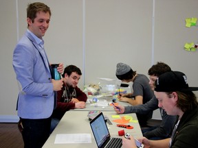 Jay McFarlan, co-Chair of the Huron Residential Hospice Site Development, stands by while some students work in the Libro Community Hall on April 12. (Justine Alkema/Clinton News Record)