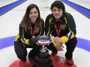 Local skips Kira Brunton and Jacob Horgan pose with their gold medals and the championships trophy at the Canadian Under-18 Curling Championships in Moncton, N.B., on Saturday. Curling Canada photo