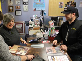 Mary Anne Peloza, owner of Cheeky Monkey, rings through customer Ryan Myers on Record Store Day Saturday. The downtown Sarnia record store reported a record number of customers lined up to participate in the annual celebration of independent record stores. Barbara Simpson/Sarnia Observer/Postmedia Network