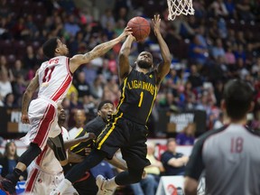 London's Kyle Johnson is defended by Windsor's Maurice Jones. (Windsor Star file photo)