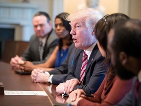 U.S. President Donald Trump meets with members of the Congressional Black Caucus in the Cabinet Room of the White House in Washington, Wednesday, March 22, 2017. (AP Photo/Andrew Harnik)