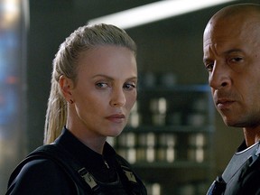 This image released by Universal Pictures shows Charlize Theron, left, and Vin Diesel in "The Fate of the Furious." (Universal Pictures via AP)