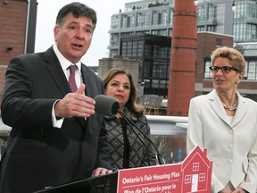 Ontario's Finace Minister Charles Sousa along with Premier Kathleen Wynne announce the Liberals Fair Housing Plan in Liberty Village on April 20, 2017, in Toronto. (Veronica Henri/Toronto Sun/Postmedia Network)