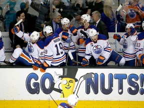 Edmonton Oilers players celebrate on the bench after a 3-1 victory against the San Jose Sharks in Game 6 of a first-round NHL hockey playoff series Saturday, April 22, 2017, in San Jose, Calif.