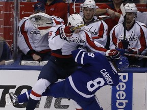 Capitals forward Andre Burakovsky hits Maple Leafs defenceman Connor Carrick during Game 6 of their first-round NHL playoff series at the Air Canada Centre in Toronto on Sunday, April 23, 2017. (Michael Peake/Toronto Sun)