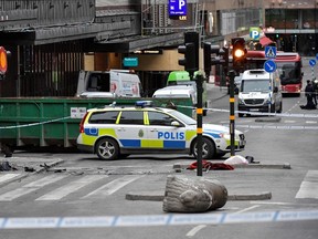 A concrete traffic stopper (down-R) lies on its flank on April 8, 2017, at the scene where a truck crashed into the Ahlens department store at Drottninggatan in central Stockholm / AFP PHOTO / TT NEWS AGENCY / Jonas EKSTROMER / Sweden OUTJONAS EKSTROMER/AFP/Getty Images  SWEDEN-TRUCK-CRASH