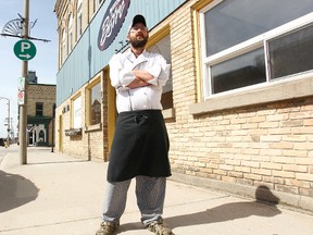 Nathan Smith, the owner of Bistro in Seaforth, stands proudly in front of his restaurant on Main Street. (Shaun Gregory/Huron Expositor)