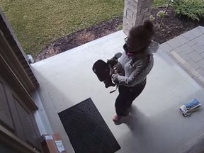 A surveillance camera video showing a woman taking a parcel from a doorstep ? an incident now under investigation by police ? has raised questions about theft in a world where cameras, videos and their airing on social media is so pervasive.
 (YouTube)
