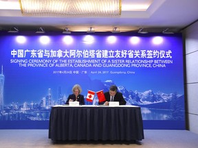 Alberta Premier Rachel Notley and MA Xingrui, governor of Guangdong, sign an agreement creating a sister-province relationship between Alberta and Guangdong. Supplied.