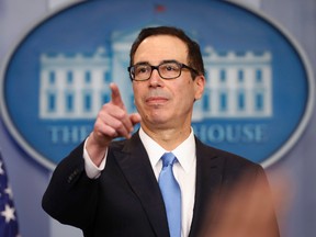 U.S. Treasury Secretary Steve Mnuchin points to a member of the media as he answers questions during the daily briefing in the Brady Press Briefing Room of the White House in Washington, Monday, April 24, 2017. (AP Photo/Pablo Martinez Monsivais)