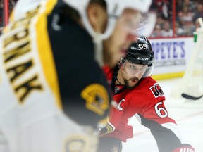 Erik Karlsson of the Ottawa Senators defends against David Pastrnak of the Boston Bruins during an NHL playoff game at Canadian Tire Centre on April 21, 2017. (Jean Levac/Postmedia)