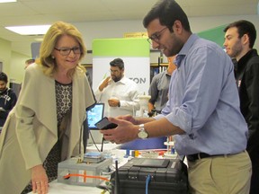 London West MP Kate Young, parliamentary secretary to the minister of science, talks Monday April24, 2017 with Roy Mathew, a post-graduate researcher at Lambton College, about research on wireless monitoring being carried out at the school in Sarnia, Ont. Young announced more than $850,000 in federal funding for new equipment for the college's Bio-industrial Process Research Centre. (Paul Morden/Sarnia Observer/Postmedia Network)
