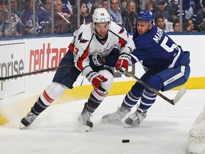 Tom Wilson of the Washington Capitals skates the puck against Martin Marincin of the Toronto Maple Leafs in Game 3 of the Eastern Conference Quarterfinals at the Air Canada Centre on April 17, 2017. (Claus Andersen/Getty Images)