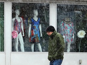 A pedestrian passes Peepers Swimwear on Corydon Avenue in Winnipeg on Mon., April 24, 2017. Kevin King/Winnipeg Sun