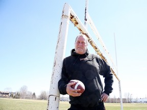 Local high school teacher Mike Derks was a former Canadian Football League offensive lineman and Grey Cup champion poses for a photo at Lasalle Secondary School in Sudbury, Ont. on Wednesday April 27, 2016. Gino Donato/Sudbury Star/Postmedia Network