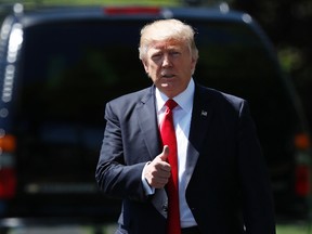 U.S. President Donald Trump gives a thumbs-up as he walks to board Marine One on the South Lawn of the White House in Washington on April 18, 2017. (Carolyn Kaster/AP Photo/File)